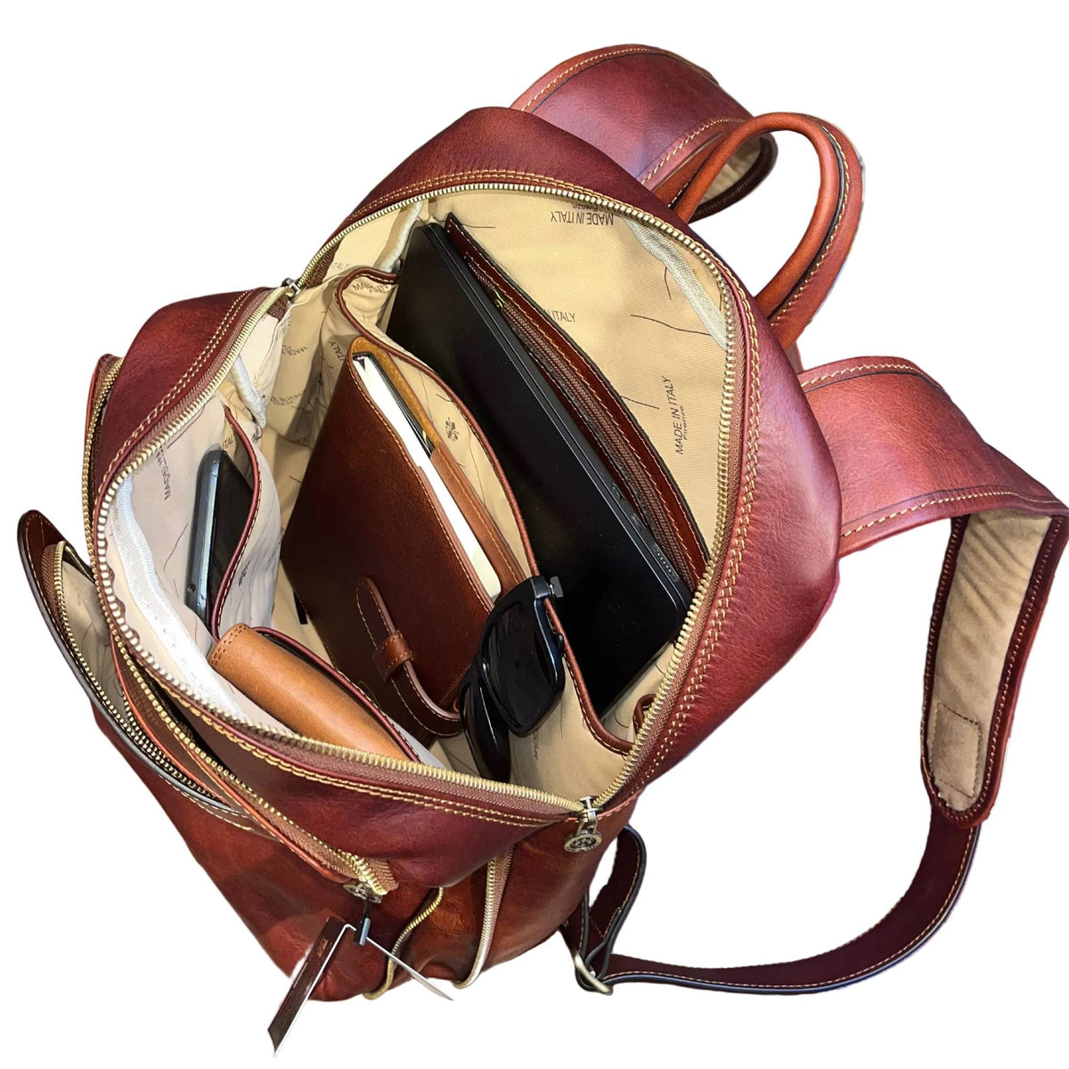 capienza interna sagittarius zaino grande espandibile in pelle marrone mogano borsa in cuoio fatta a mano made in italy cuoieria italiana®