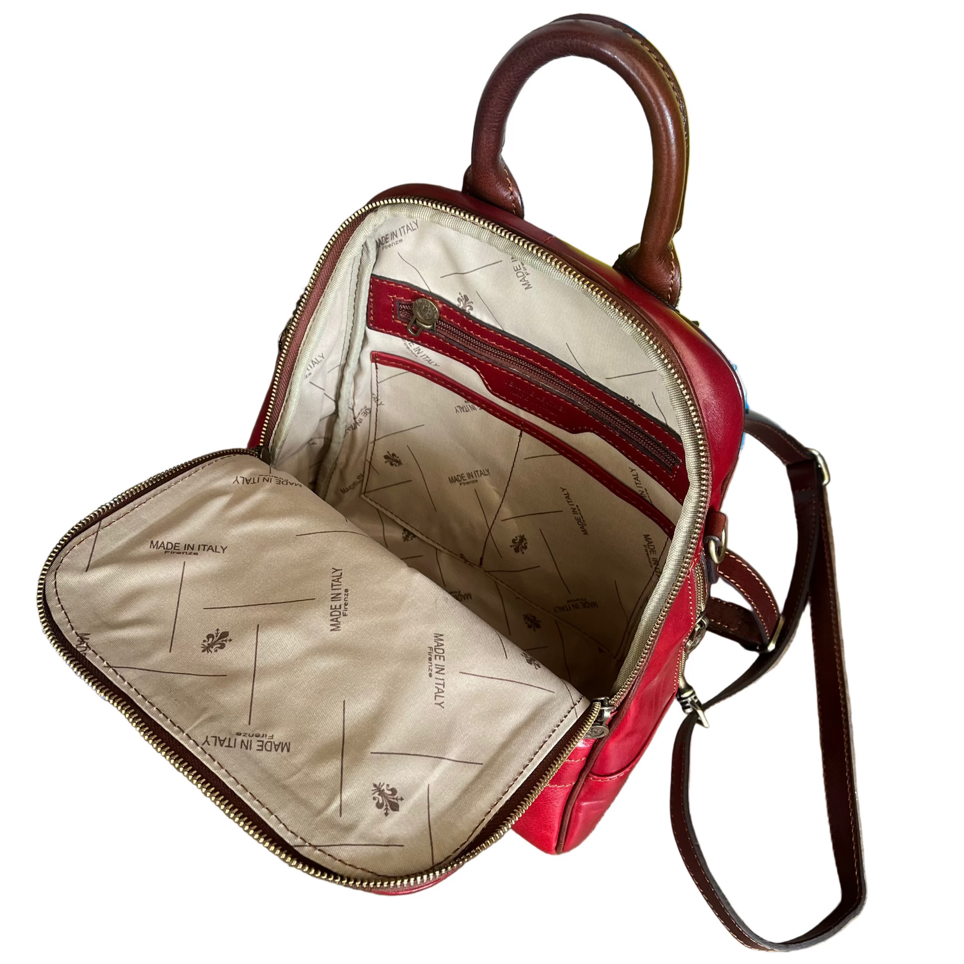 scomparto interno e tasche reporter zaino medio compatto in pelle rosso e marrone borsa trasformabile a tracolla in cuoio made in italy cuoieria italiana
